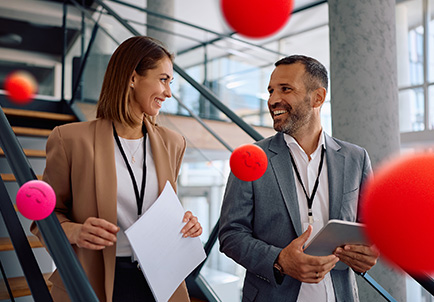 Professionals conversing in modern office with tablet and documents